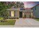 Charming single-story home featuring a well-maintained lawn, covered entryway, and attached garage in a desirable neighborhood at 9016 Water Chestnut Dr, Temple Terrace, FL 33637