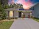 Charming single-story home featuring a well-maintained lawn, covered entryway, and attached garage in a desirable neighborhood at 9016 Water Chestnut Dr, Temple Terrace, FL 33637