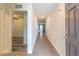Inviting hallway with tile flooring, neutral paint, and a glimpse of the bright, open living spaces at 9016 Water Chestnut Dr, Temple Terrace, FL 33637