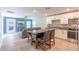 Open floor plan showcasing kitchen and living room with outdoor access at 9016 Water Chestnut Dr, Temple Terrace, FL 33637