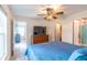 Spacious main bedroom with ceiling fan, ensuite bathroom, and walk-in closet at 9016 Water Chestnut Dr, Temple Terrace, FL 33637