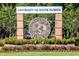 University of South Florida sign with landscaping and brick columns on a sunny day at 9016 Water Chestnut Dr, Temple Terrace, FL 33637