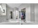 This bathroom boasts a garden tub and a walk in shower as well as a large walk in closet at 9202 Brindlewood Dr, Odessa, FL 33556