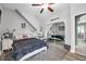 Comfortable bedroom with ceiling fan, closet with mirrored sliding doors, and relaxing atmosphere at 9202 Brindlewood Dr, Odessa, FL 33556