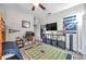 Inviting bedroom with sports decor, including a flat screen tv, and comfortable layout at 9202 Brindlewood Dr, Odessa, FL 33556
