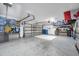 Spacious garage with painted floors and multiple storage options at 9202 Brindlewood Dr, Odessa, FL 33556