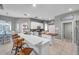 Stylish kitchen featuring a breakfast bar, stainless steel appliances, and modern sliding barn door at 9202 Brindlewood Dr, Odessa, FL 33556
