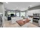Open kitchen with stainless appliances, white cabinets, butcher block island, and seamless transition to the living area at 9202 Brindlewood Dr, Odessa, FL 33556