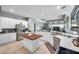 Modern kitchen equipped with stainless steel appliances, butcher block island, and overlooks the living area at 9202 Brindlewood Dr, Odessa, FL 33556