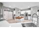 Bright kitchen with stainless steel appliances, butler's pantry, a breakfast bar, and a view to the lanai at 9202 Brindlewood Dr, Odessa, FL 33556