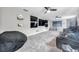Media room with carpeting, ceiling fans, mini fridge and home theater seating at 9202 Brindlewood Dr, Odessa, FL 33556