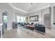 Bright living room featuring modern decor, an accent wall, and sliding doors for indoor-outdoor living at 9202 Brindlewood Dr, Odessa, FL 33556