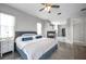Serene primary bedroom featuring a fireplace, natural light, and ensuite bathroom at 9202 Brindlewood Dr, Odessa, FL 33556