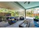 Relaxing covered patio with pool and outdoor kitchen area at 9202 Brindlewood Dr, Odessa, FL 33556
