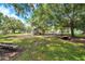 Community playground with picnic tables, benches, and shade trees for a relaxing time at 9202 Brindlewood Dr, Odessa, FL 33556
