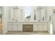 Bathroom featuring double vanity, white cabinets, and modern fixtures at 9497 Minnow Ray Dr, Land O Lakes, FL 34638