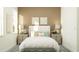 Bright bedroom with soft decor, plush bed, and stylish matching bedside tables at 9497 Minnow Ray Dr, Land O Lakes, FL 34638