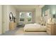 Bright bedroom features a bed with upholstered headboard, striped rug, two chairs, natural decor, and lots of natural light at 9497 Minnow Ray Dr, Land O Lakes, FL 34638