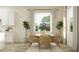 Comfortable dining room with seating for six, modern decor, and a view of the landscaped backyard at 9497 Minnow Ray Dr, Land O Lakes, FL 34638