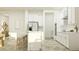 Bright, modern kitchen featuring stainless steel appliances and a spacious island with barstool seating at 9497 Minnow Ray Dr, Land O Lakes, FL 34638