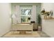 Home office with a clean desk, natural light, and modern decor for a productive workspace at 9497 Minnow Ray Dr, Land O Lakes, FL 34638