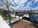 Waterfront property featuring a private dock, with direct water access and space for leisure and recreation by the water at 1008 Sago Palm Way, Apollo Beach, FL 33572