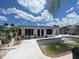 Backyard showcasing the private pool area, perfect for outdoor enjoyment in this cozy single Gathering home in a great location at 1008 Sago Palm Way, Apollo Beach, FL 33572