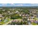Scenic aerial view of a planned community showcasing homes, a pond, lush green spaces, and recreational areas at 10409 Glen Willow Ln, Tampa, FL 33647