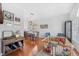 Open-concept dining room with hardwood floors and views into living area at 10409 Glen Willow Ln, Tampa, FL 33647