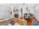 Open-concept living area with hardwood floors and elegant lighting fixtures at 10409 Glen Willow Ln, Tampa, FL 33647