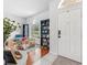Bright living room with hardwood floors, large windows, and ample natural light at 10409 Glen Willow Ln, Tampa, FL 33647