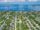 Stunning aerial view of a coastal community with easy access to the bay, showcasing the neighborhood and water views at 1136 Granada St, Clearwater, FL 33755