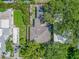 Aerial view of the property showcasing the roof and surrounding greenery at 1136 Granada St, Clearwater, FL 33755