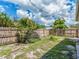 Large, fenced backyard featuring unique plants at 1136 Granada St, Clearwater, FL 33755