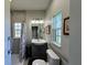 Clean, bright bathroom with a new vanity, shower and updated fixtures at 1136 Granada St, Clearwater, FL 33755