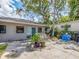 This concrete patio is spacious and private, perfect for outdoor entertaining and relaxation under mature shade trees at 1136 Granada St, Clearwater, FL 33755