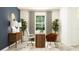 Inviting home office featuring modern decor, comfortable seating, and natural light at 11828 Sparkling Topaz Cv, Parrish, FL 34219