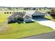 Aerial view showcases the home and airplane hangar close to the airstrip and taxi-way at 11908 Pilot Country Dr, Spring Hill, FL 34610