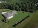 Aerial shot showcasing a sprawling property with a large lot and screened-in enclosure at 11908 Pilot Country Dr, Spring Hill, FL 34610