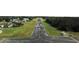 Airstrip, near a home with a hangar, offers convenient access for aviation enthusiasts at 11908 Pilot Country Dr, Spring Hill, FL 34610