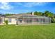 Large screened-in patio is perfect for outdoor dining and relaxation at 11908 Pilot Country Dr, Spring Hill, FL 34610