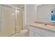 Clean bathroom with a glass-enclosed shower, toilet, and vanity with a cream-colored sink at 11908 Pilot Country Dr, Spring Hill, FL 34610