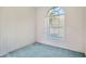 Bright bedroom with a large arched window offering natural light and a peaceful atmosphere at 11908 Pilot Country Dr, Spring Hill, FL 34610
