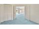 Spacious bedroom featuring large closet and an open doorway to a large open room at 11908 Pilot Country Dr, Spring Hill, FL 34610