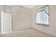 Neutral bedroom featuring a window that provides natural light at 11908 Pilot Country Dr, Spring Hill, FL 34610