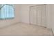 Bright bedroom features a large closet and natural light at 11908 Pilot Country Dr, Spring Hill, FL 34610