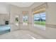 Bright breakfast nook features tile flooring, views of the lanai, and seamless access to the outdoor living space at 11908 Pilot Country Dr, Spring Hill, FL 34610