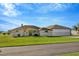 Charming single-story home with a well-manicured lawn and large airplane hangar at 11908 Pilot Country Dr, Spring Hill, FL 34610
