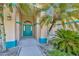 Inviting front door with decorative accents, framed by lush tropical landscaping at 11908 Pilot Country Dr, Spring Hill, FL 34610