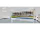 Spacious garage with high ceilings and a bi-fold door opening to the yard at 11908 Pilot Country Dr, Spring Hill, FL 34610